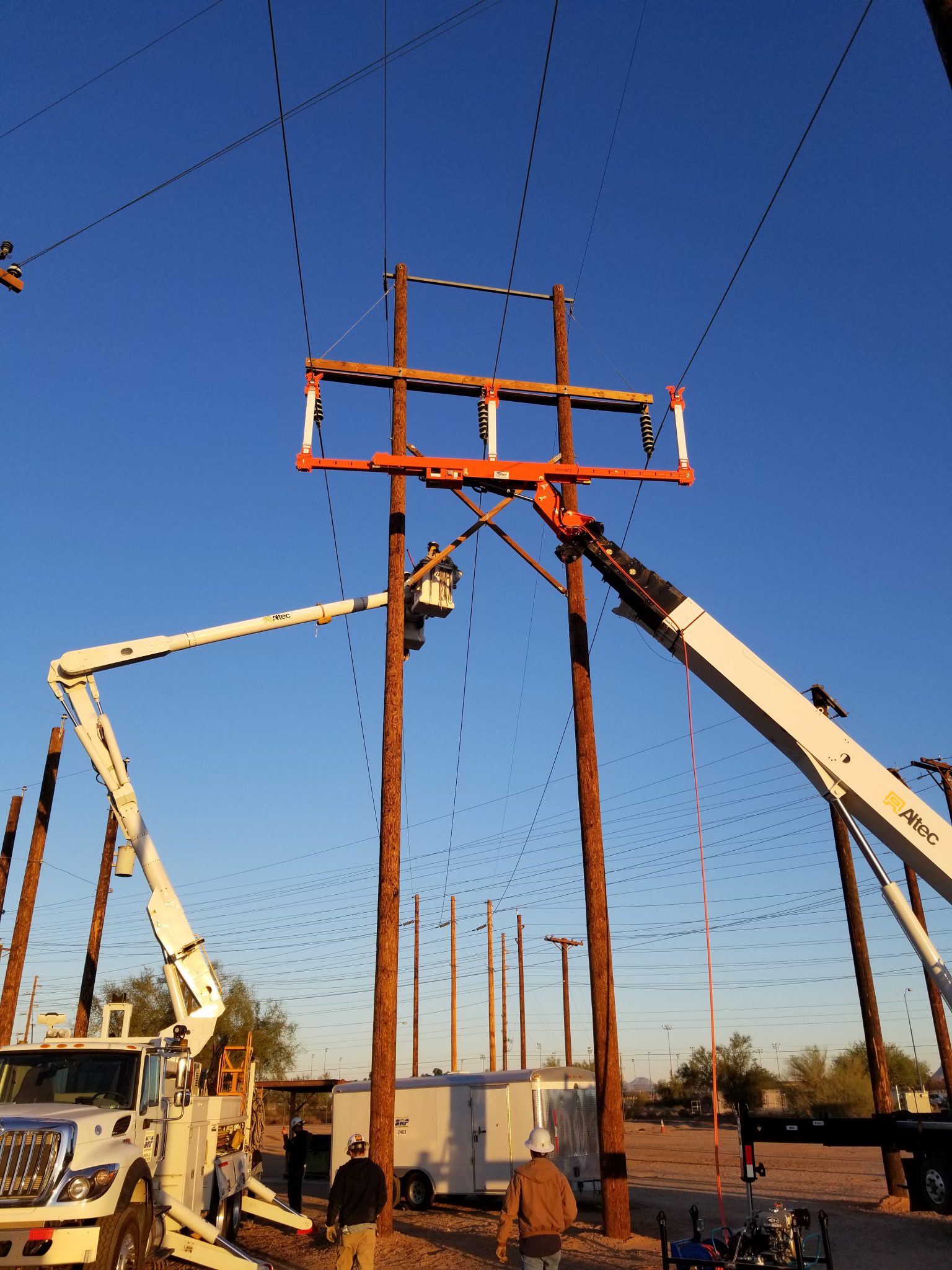 Linemen Handle Energized Conductors With Insulated Line Lifter LineWise